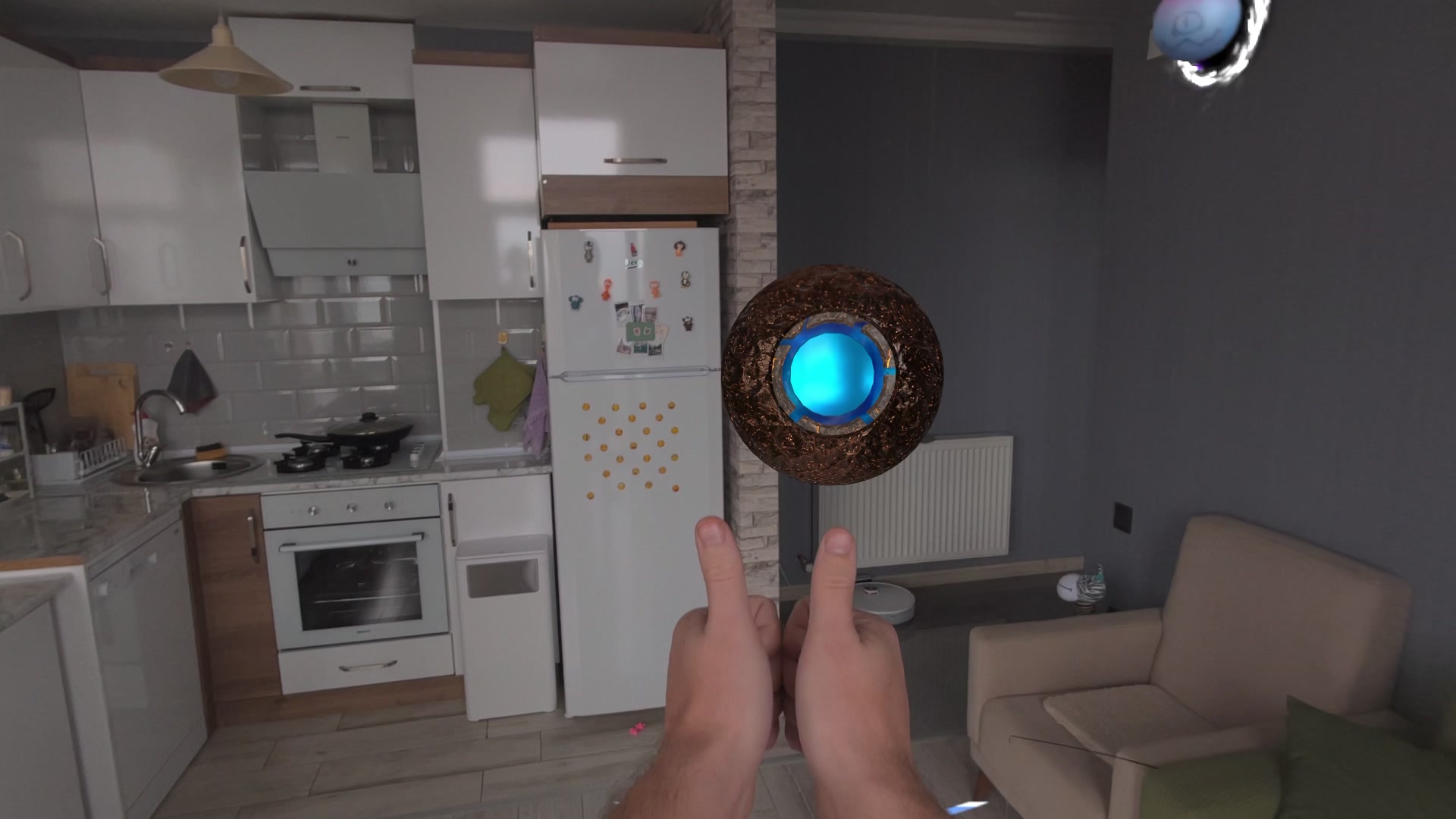 A charged orb with a glowing blue core held between two bare hands